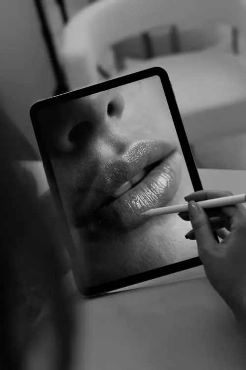 Ruth planning a lip design on a tablet